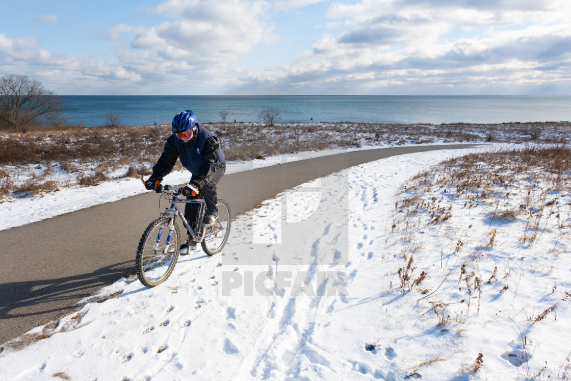"Dedicated Cyclist Riding Up Snowy Hill" by Beth Baisch - $12.33 "Dedicated Cyclist Riding Up Snowy Hill" stock image