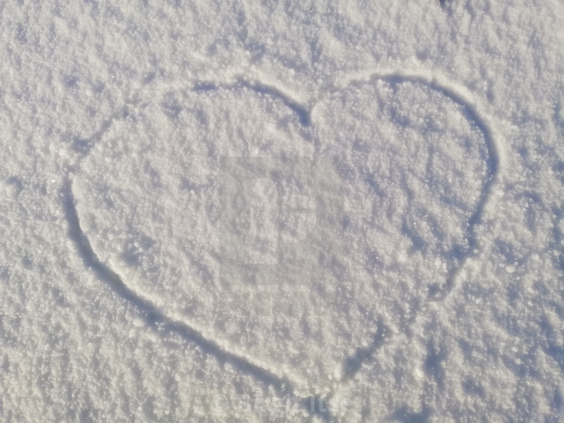 "Heart on a snow" stock image