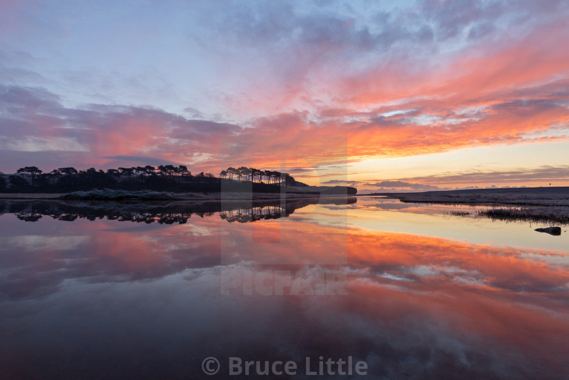 "New Years Sunrise at Budleigh Salterton" by Bruce Little - $30.86 "New Years Sunrise at Budleigh Salterton" stock image