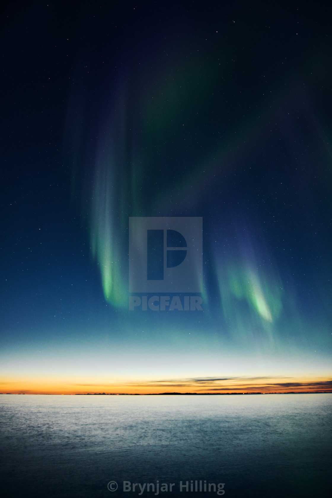 "northern lights and sunset" stock image