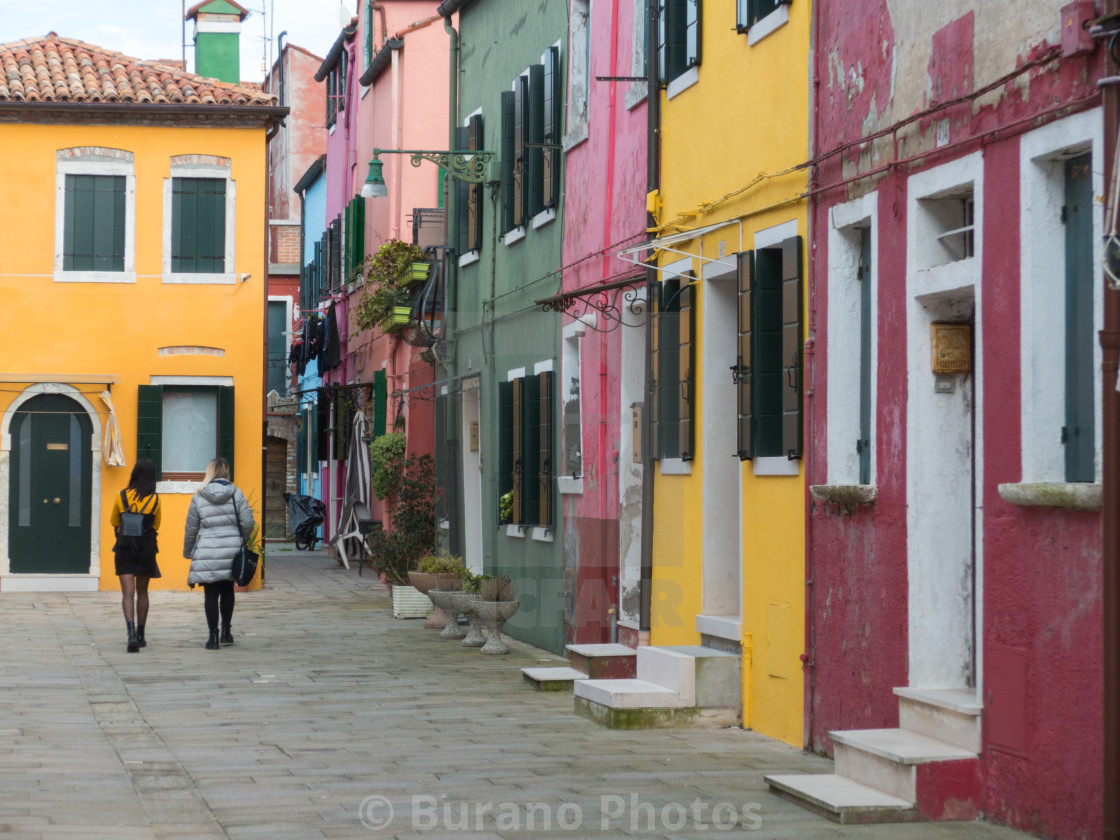 "The girl in yellow in front of the yellow house" stock image