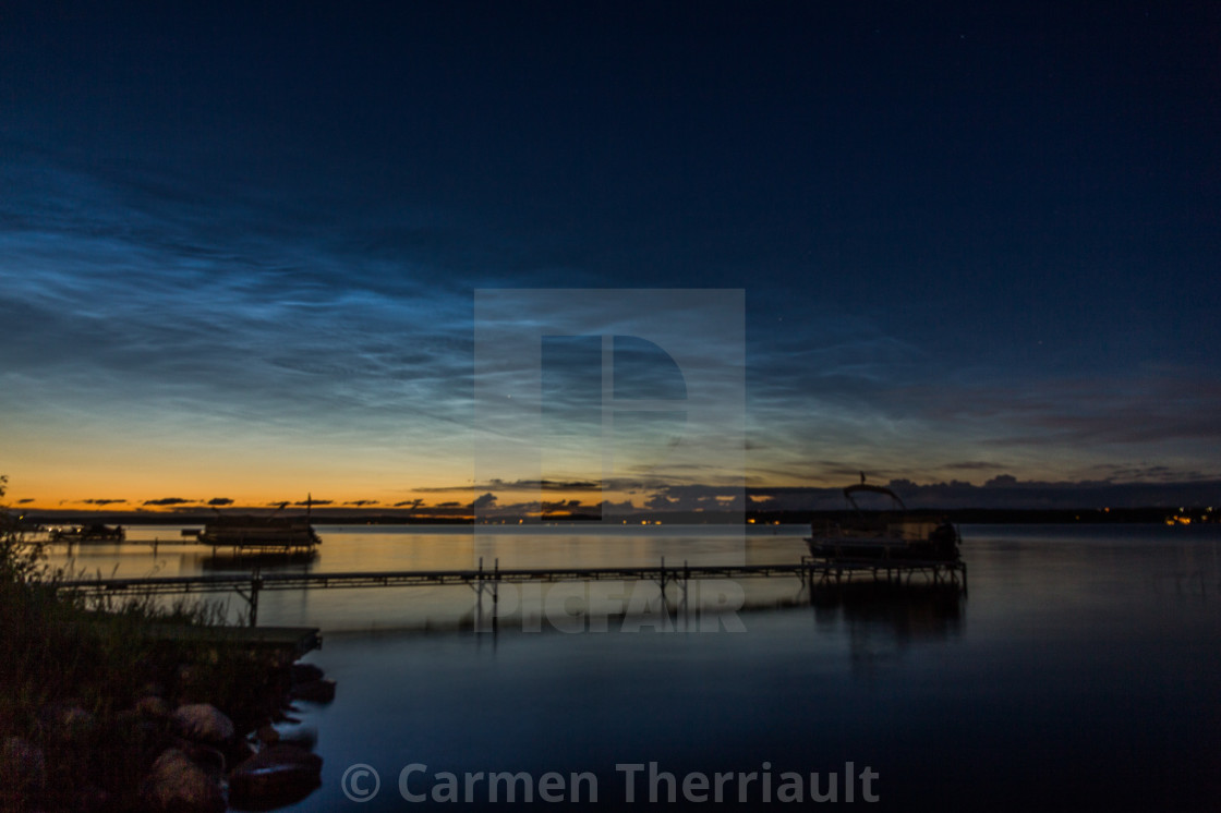 "Noctilucent clouds over lake" by Carmen Therriault - $15.31 "Noctilucent clouds over lake" stock image