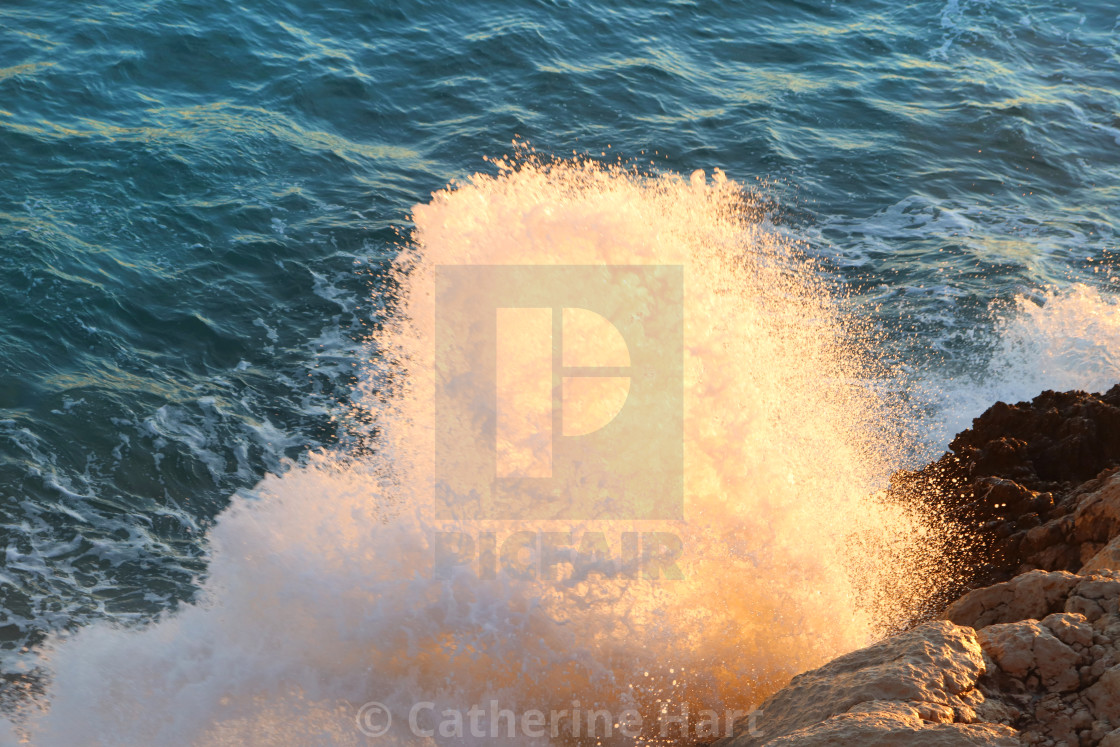 "Sunshine through the waves" stock image