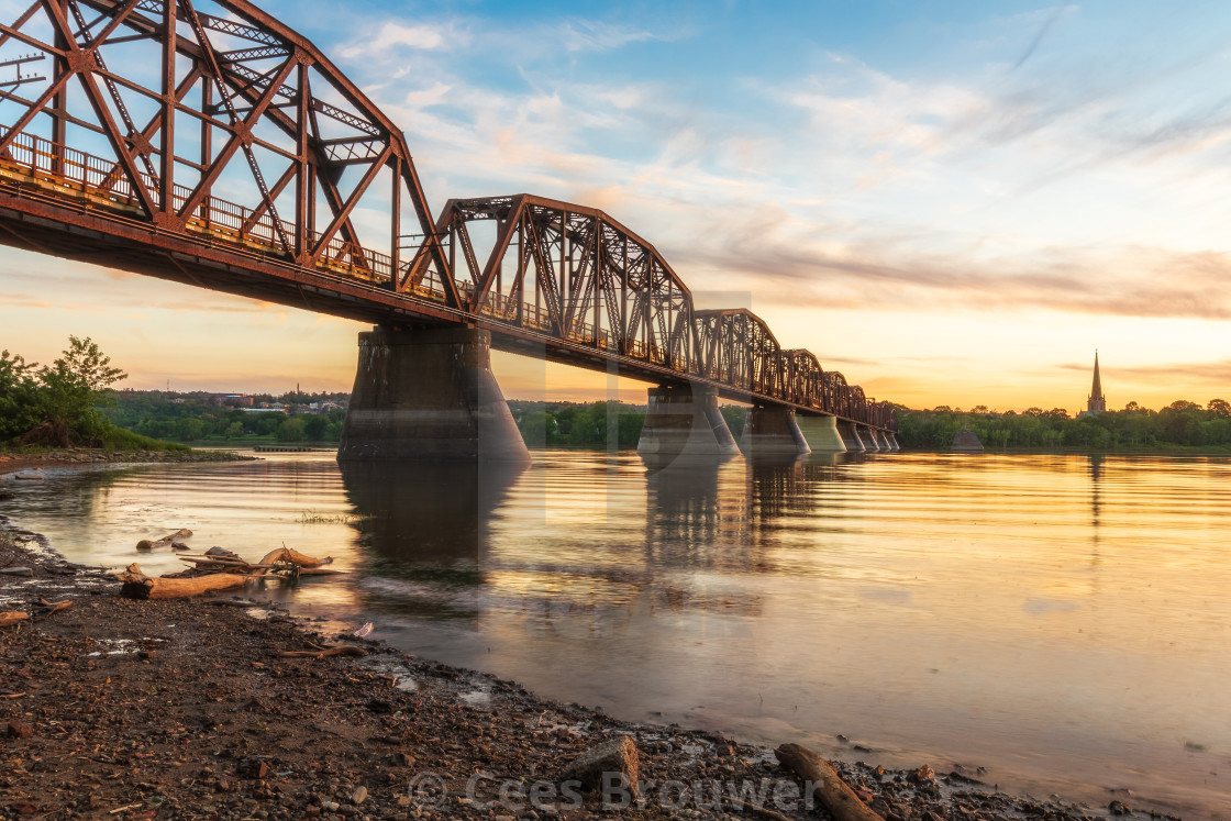 "Bridge over calm water" stock image