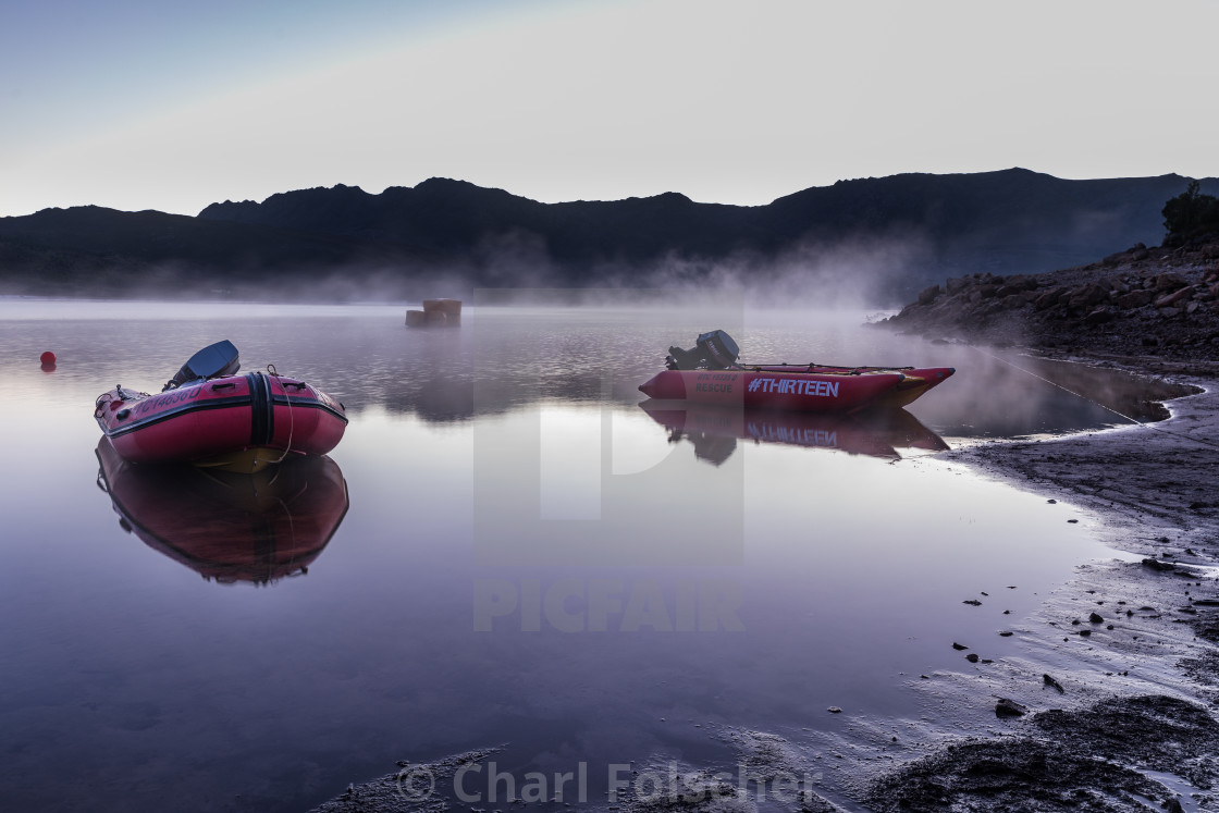"Rubber duck boats reflected in a misty lake in the morning" by Charl Folscher - £12.40 "Rubber duck boats reflected in a misty lake in the morning" stock image