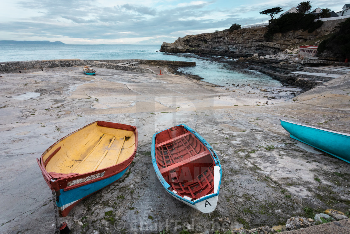 "Old colourful row boats on dry ground in a small harbour" by Charl Folscher - £12.40 "Old colourful row boats on dry ground in a small harbour" stock image