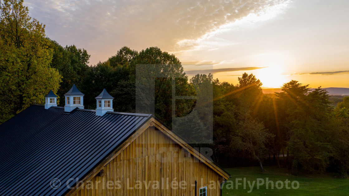 "Sun setting over the Old Oak Barn" stock image