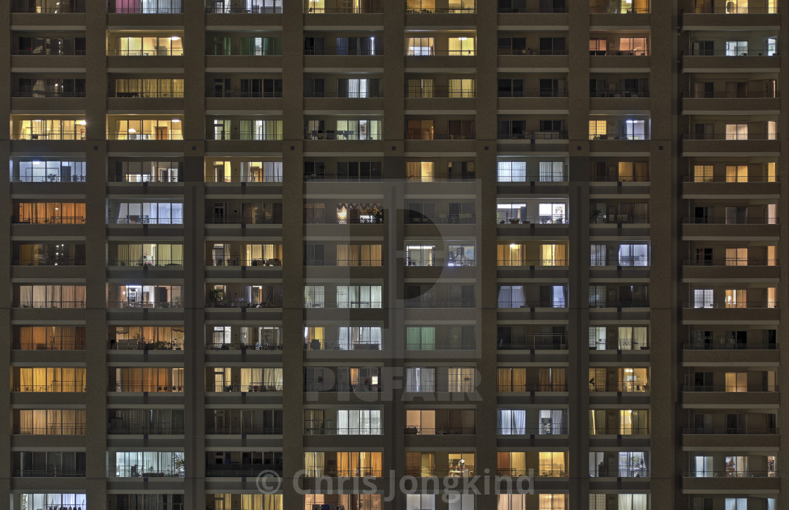 "Illuminated Windows at Night on Residential Building" by Chris Jongkind - $30.49 "Illuminated Windows at Night on Residential Building" stock image