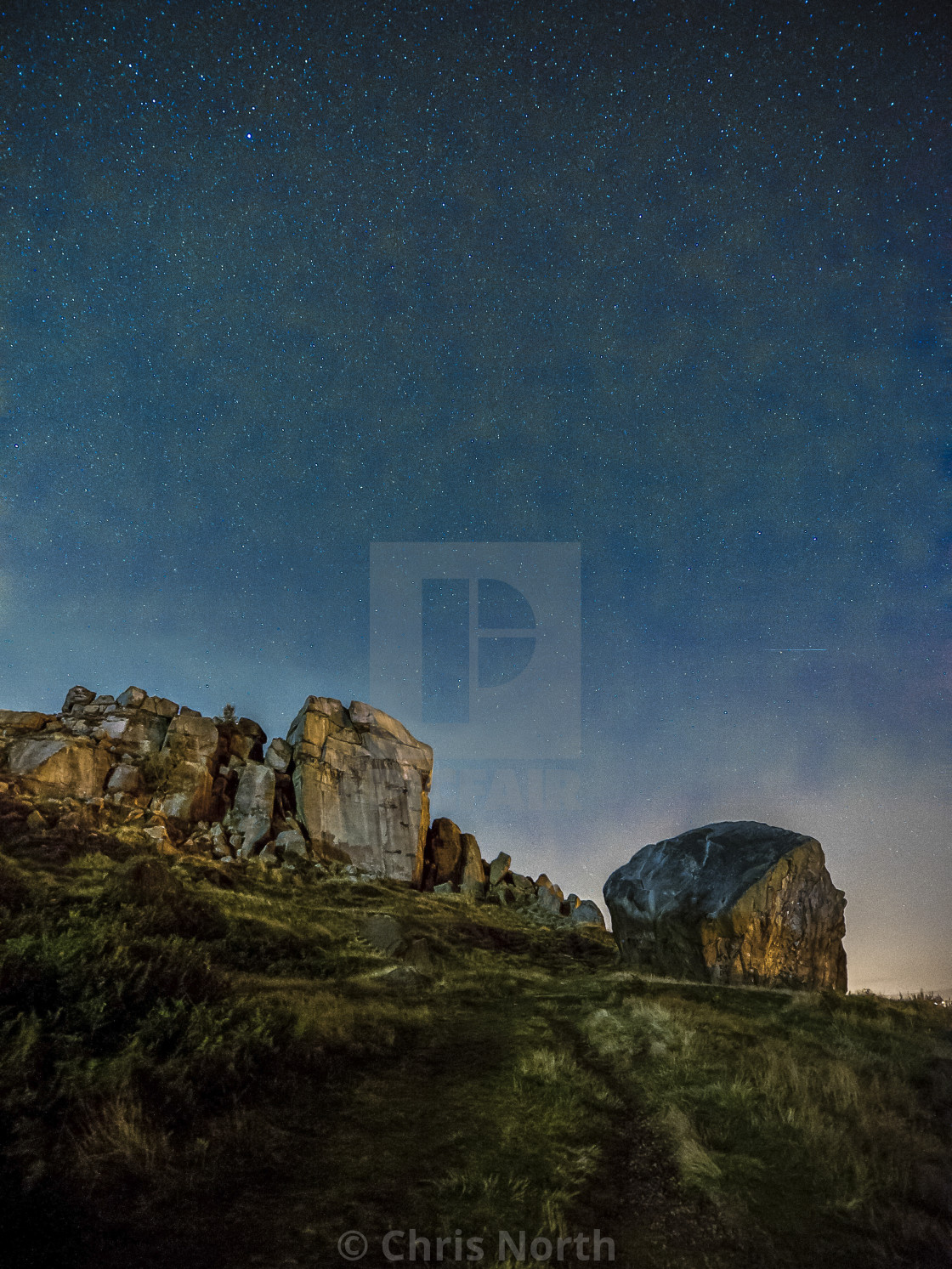 "Cow and calf rocks by starlight." stock image