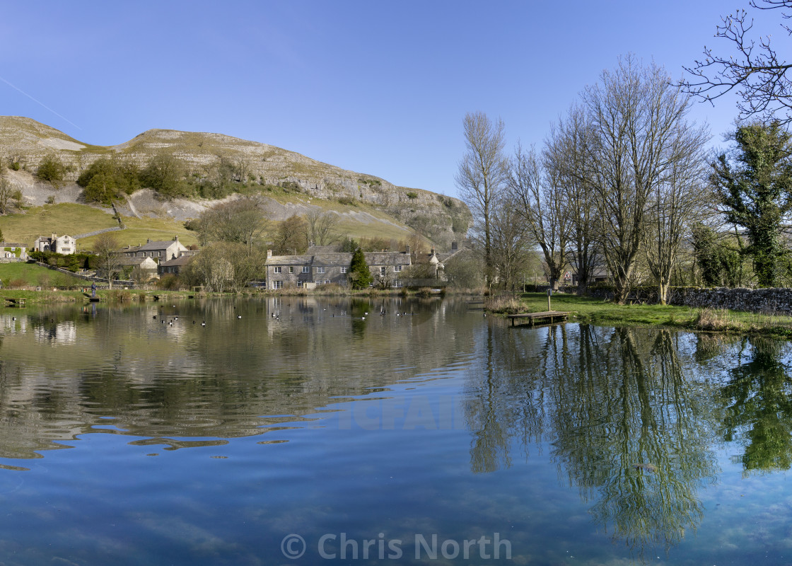 "Kilnsey Trout Farm Lake with Kilnsey Crag in the background." stock image