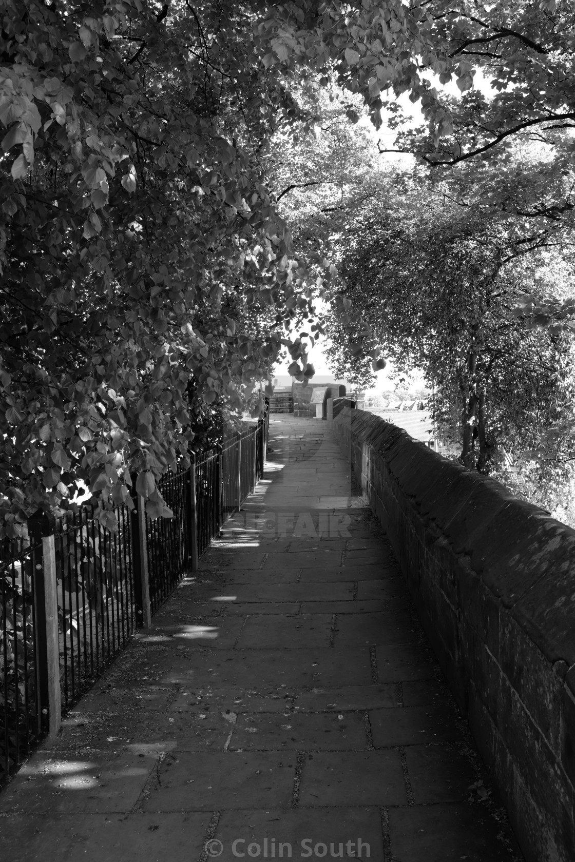 "Chester’s city walls in the shade." by Colin South - £8.00 "Chester’s city walls in the shade." stock image