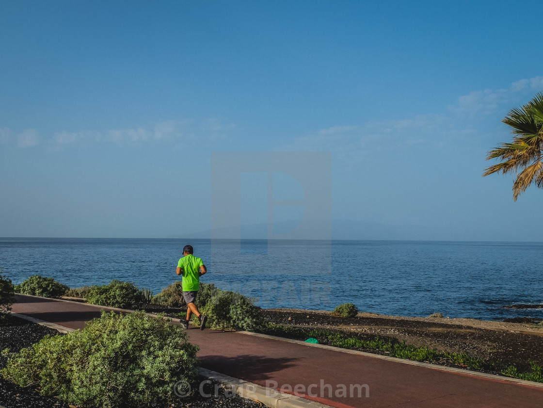 "Jogger along the coast" stock image