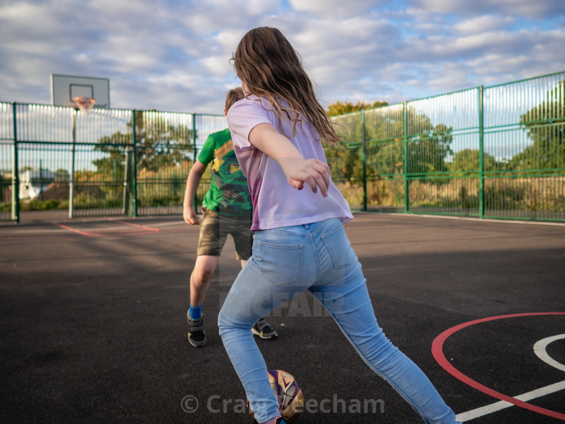 "Evening playing football" stock image