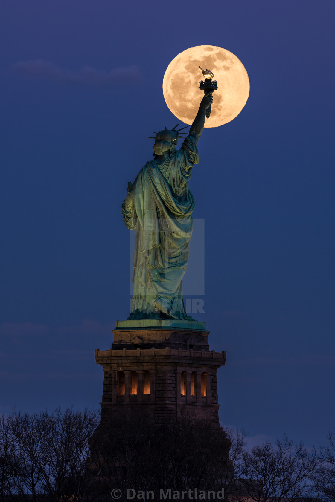 "Statue Liberty and the Full Moon" stock image