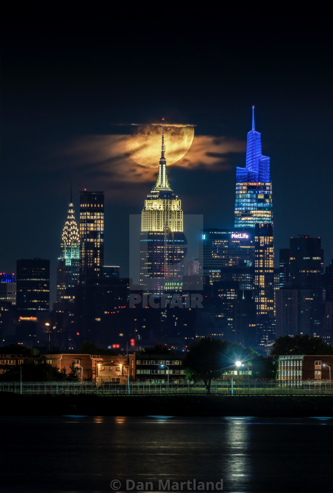 "Just another setting moon over NYC" stock image