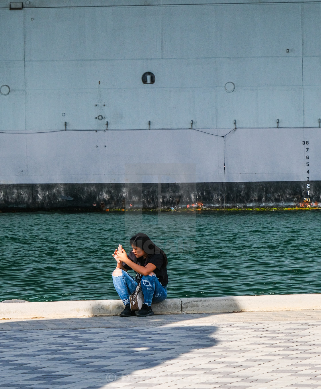 "Woman Taking Picture of Midway Statue" by Darryl Brooks - $10.81 "Woman Taking Picture of Midway Statue" stock image