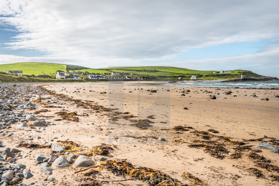 "Port Logan, Dumfries & Galloway, Scotland - Sep 8 2020; Port Logan and Harbour wall from the rocky foreshore" stock image