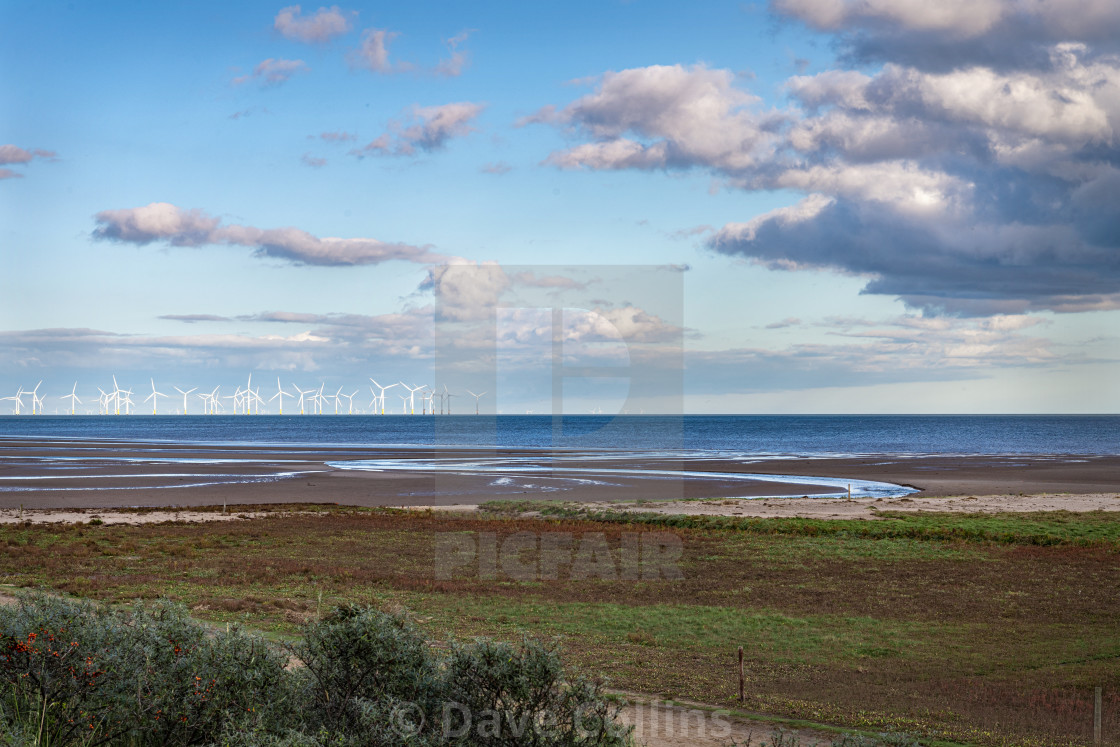 "Lincolnshire Coast, with offshore wind turbines, England" stock image