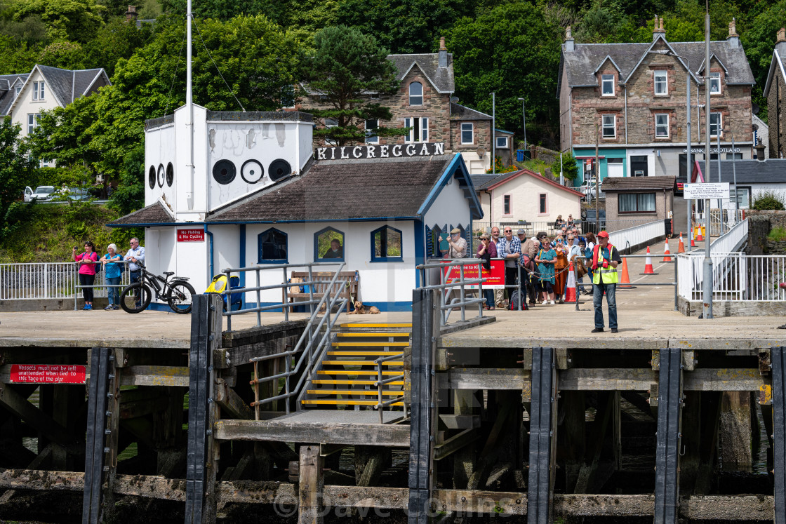 "Passengers and Crew on the Pier at Kilcreggan on the Rosneath peninsula in Argyll and Bute, Scotland" stock image