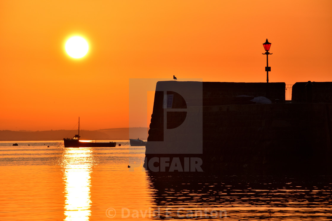 "Sunrise at Tenby harbour" stock image