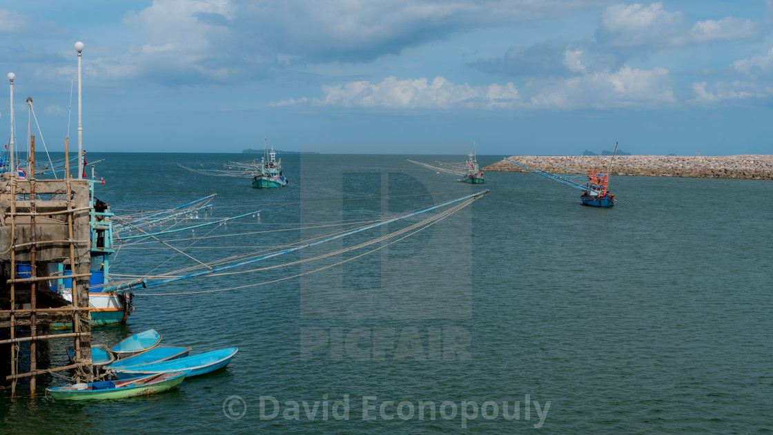 Three Traditional Thai Fishing Boats With Outriggers Out Just Off The Dock License Download Or Print For 7 52 Photos Picfair