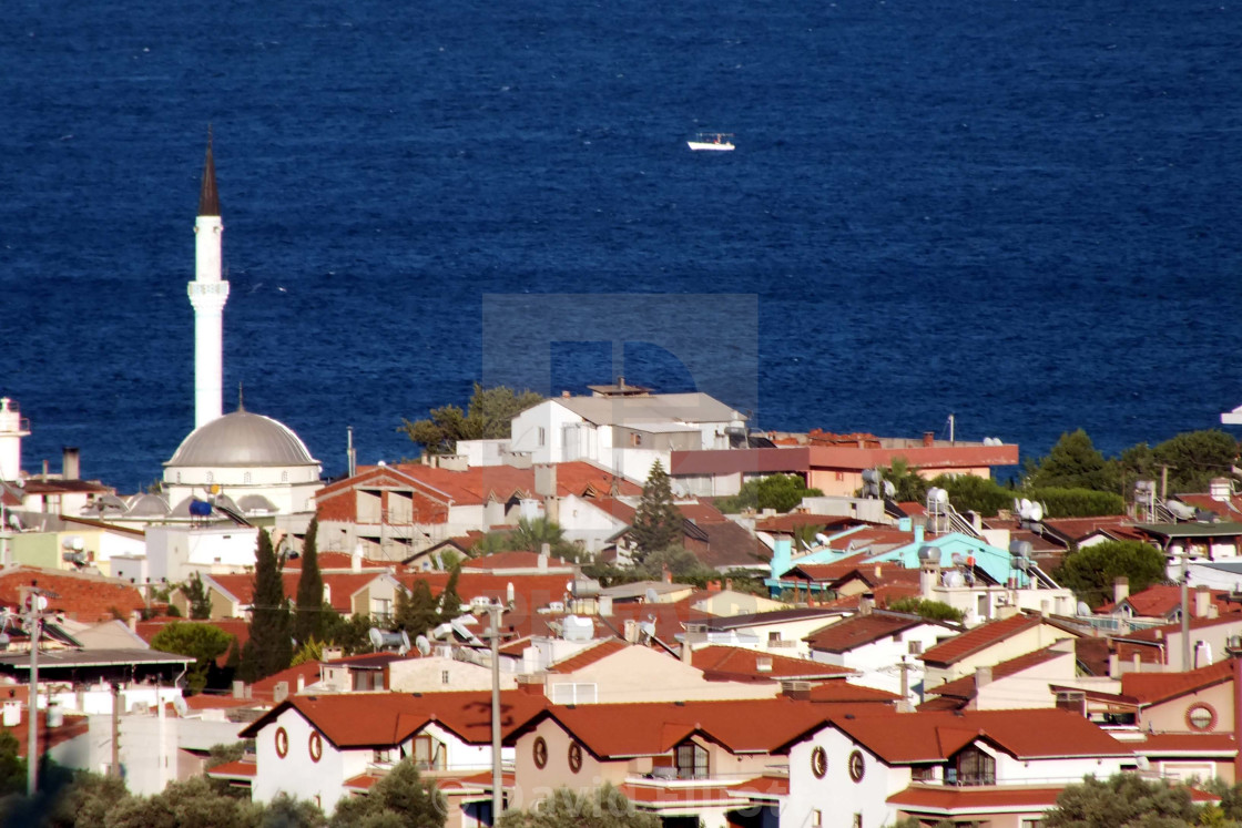 A View Across The Rooftops Of A Turkish Town With Mosque And Minaret And Aegean Sea Beyond License Download Or Print For 12 40 Photos Picfair