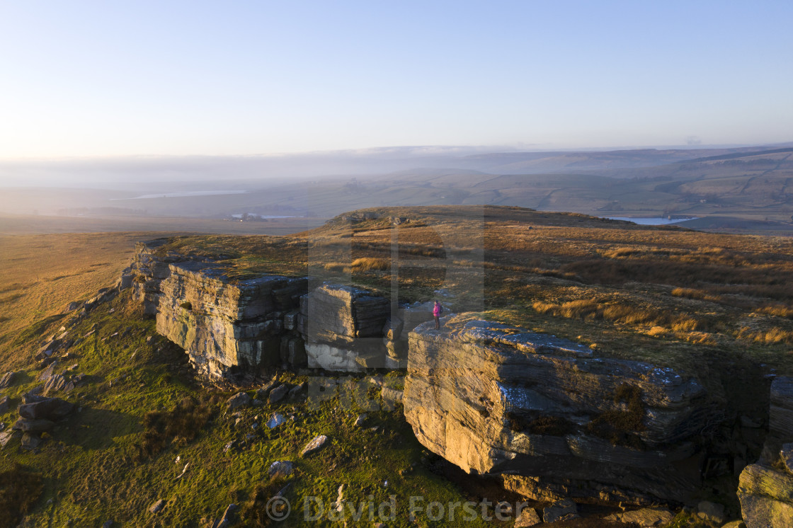 "Goldsborough Hill and Walker at sunset, Teesdale, County Durham, UK" stock image