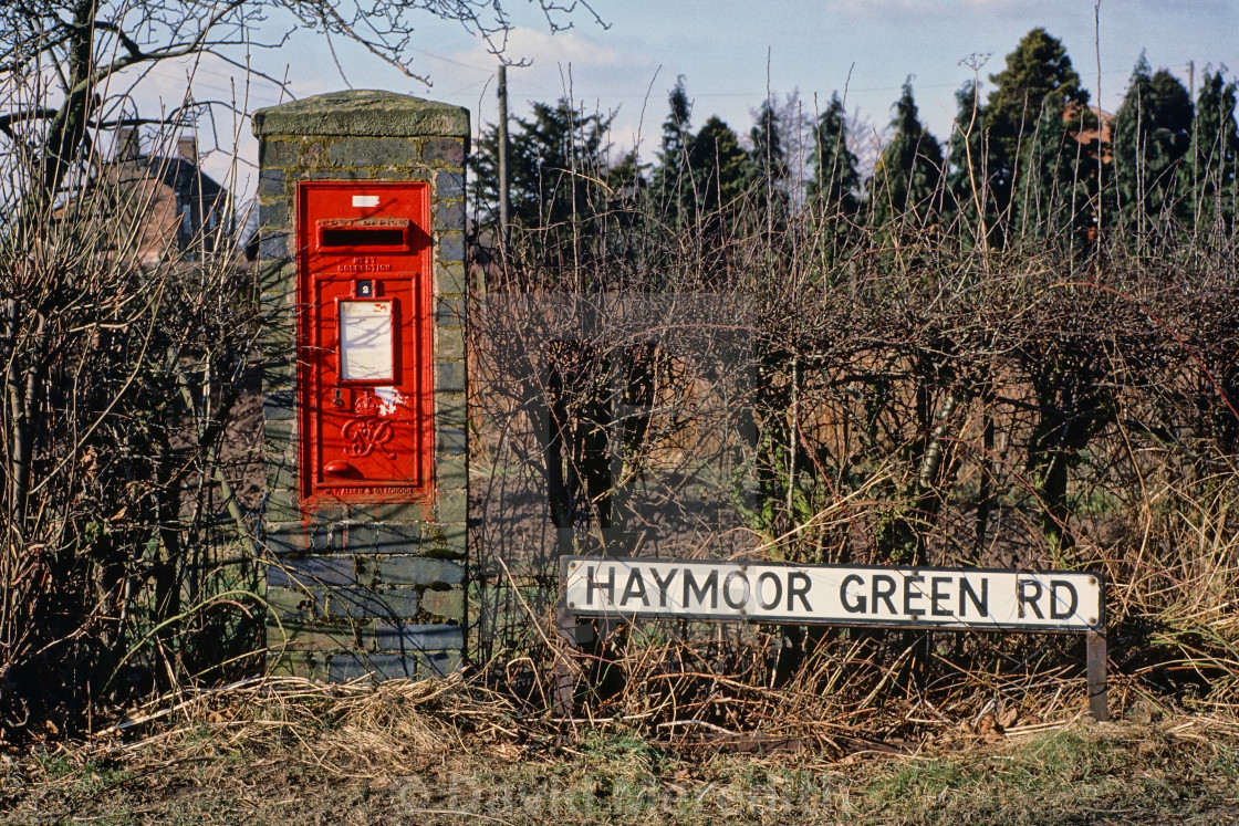 "Red post box on Haymoor Green Road" stock image