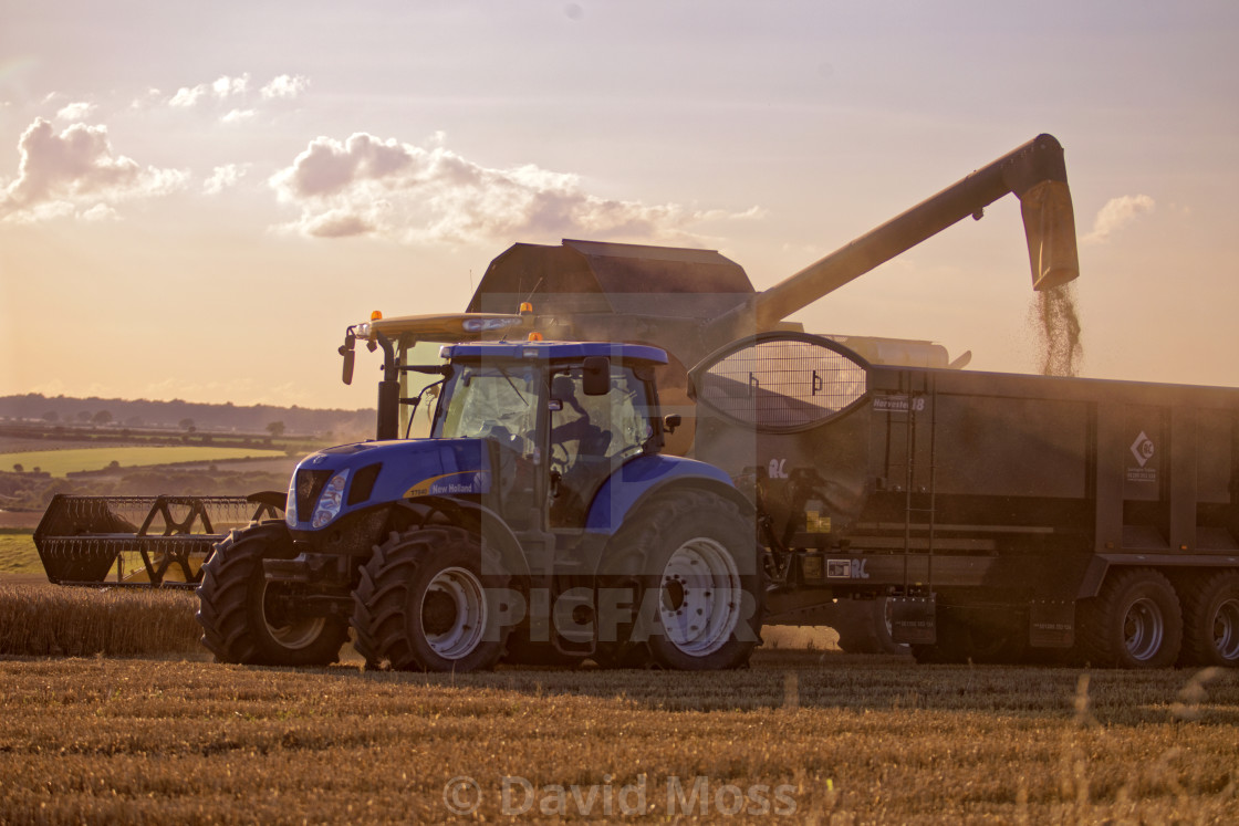 "Combine Harvesters at work harvest time on Farm" by David Moss - £62.00 "Combine Harvesters at work harvest time on Farm" stock image