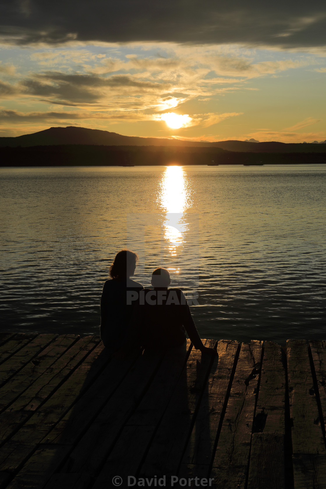 "People on the Pier at Sunset, promenade, Puerto Natales city, Patagonia,..." stock image