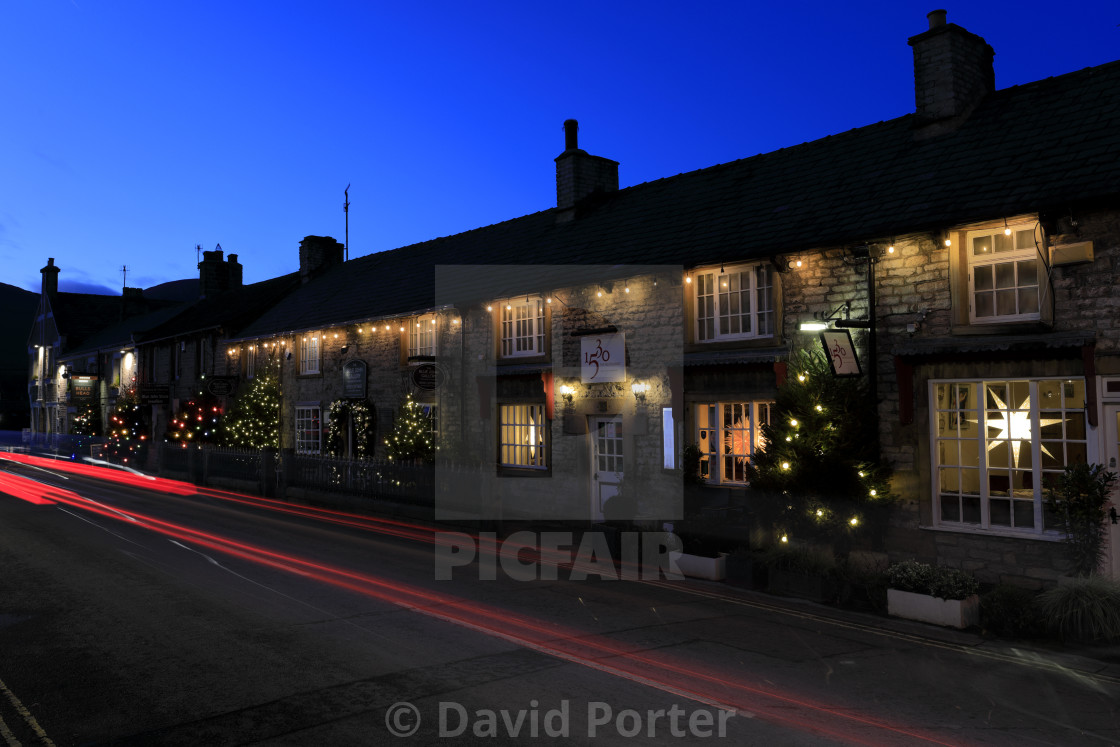 "Christmas Lights along Cross Street, Castleton village, Derbyshire, Peak..." stock image