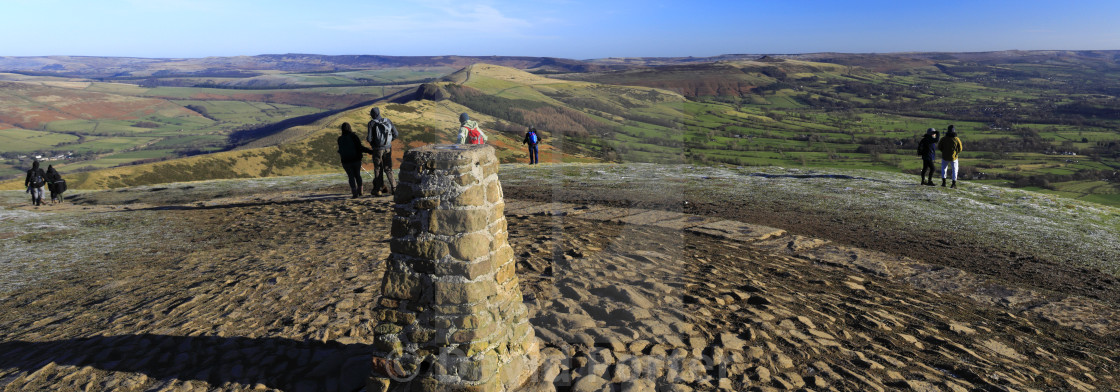 "Walkers at Mam Tor summit cairn, Vale of Castleton, Derbyshire, Peak District..." stock image