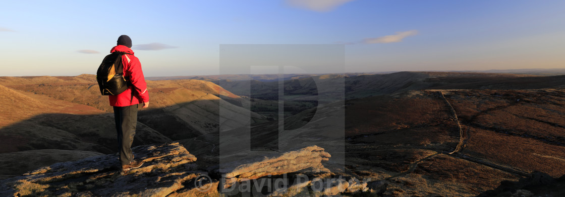 "Walker on rock formations, Kinder Scout, Pennine Way, Derbyshire, Peak..." stock image