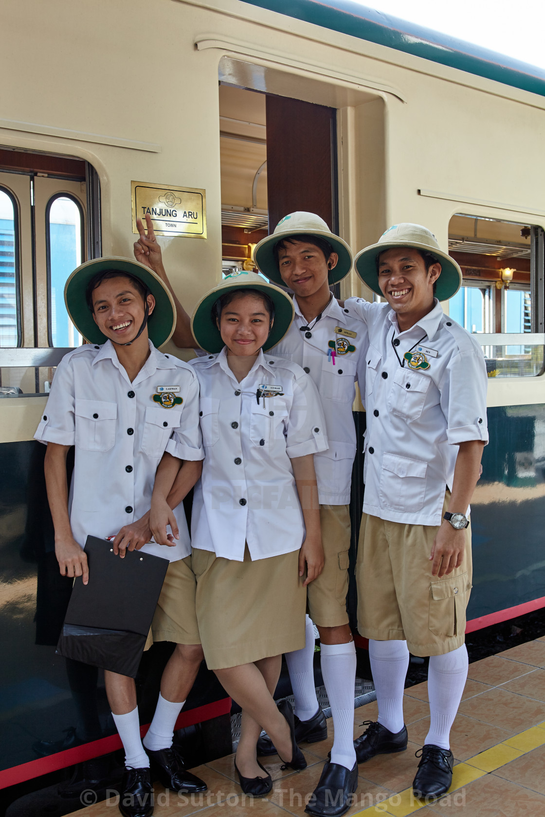 "The friendly crew who look after the guests on the North Borneo Railway at..." stock image