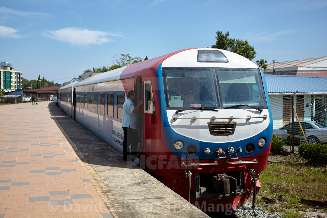 "Modern diesel passenger train at Beaufort, Sabah State Railways, Malaysia" stock image