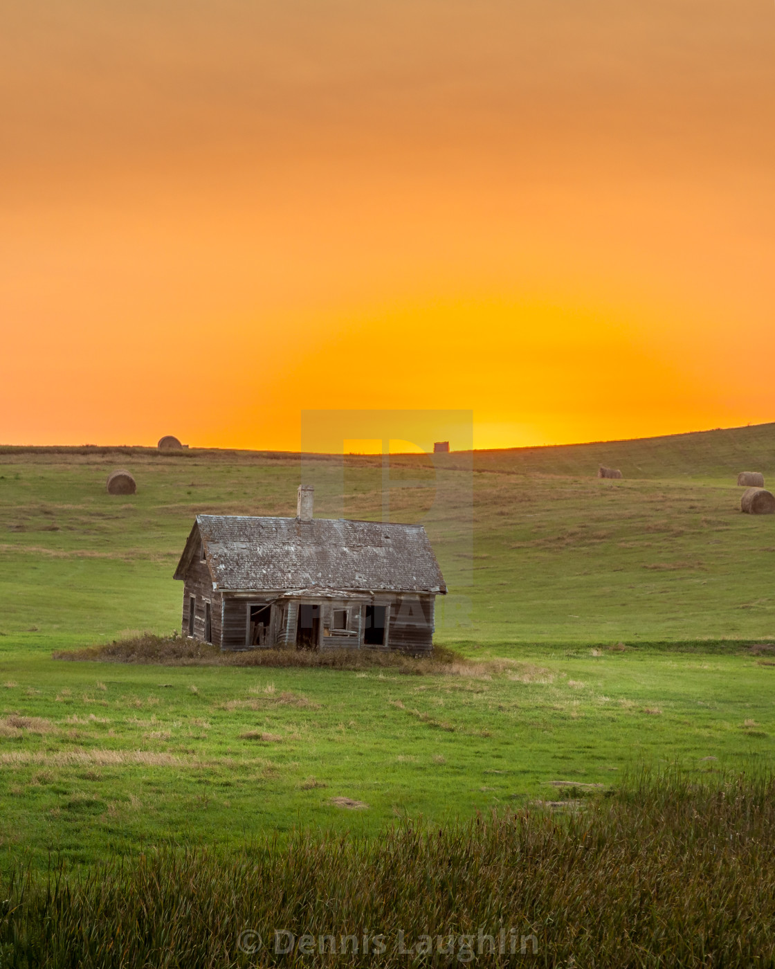 "Abandoned farm house at sunset" stock image