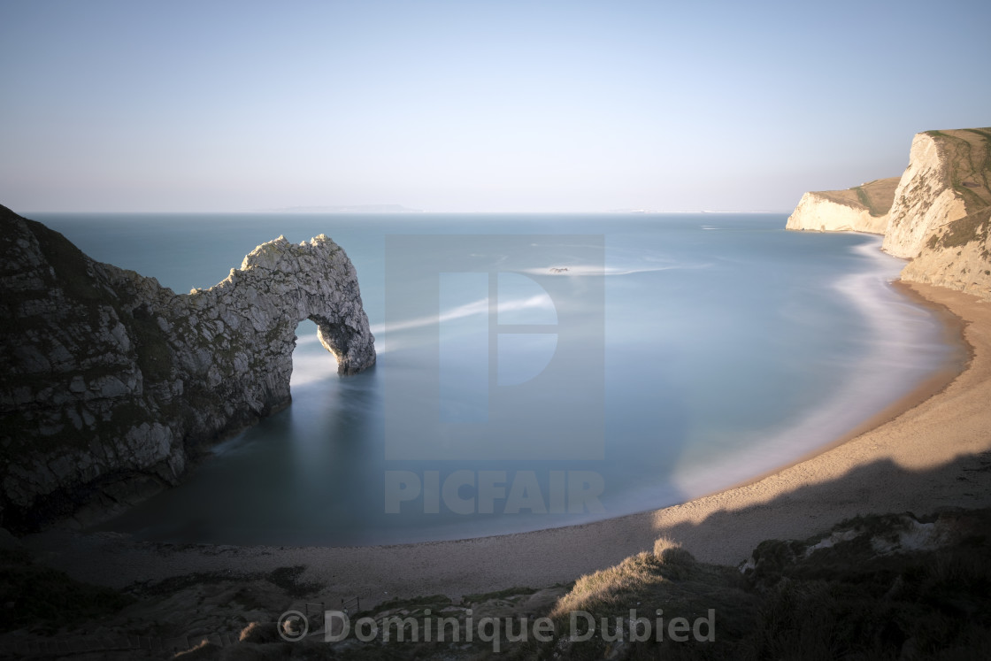 "Durdle Door awakening" by Dominique Dubied - $22.96 "Durdle Door awakening" stock image