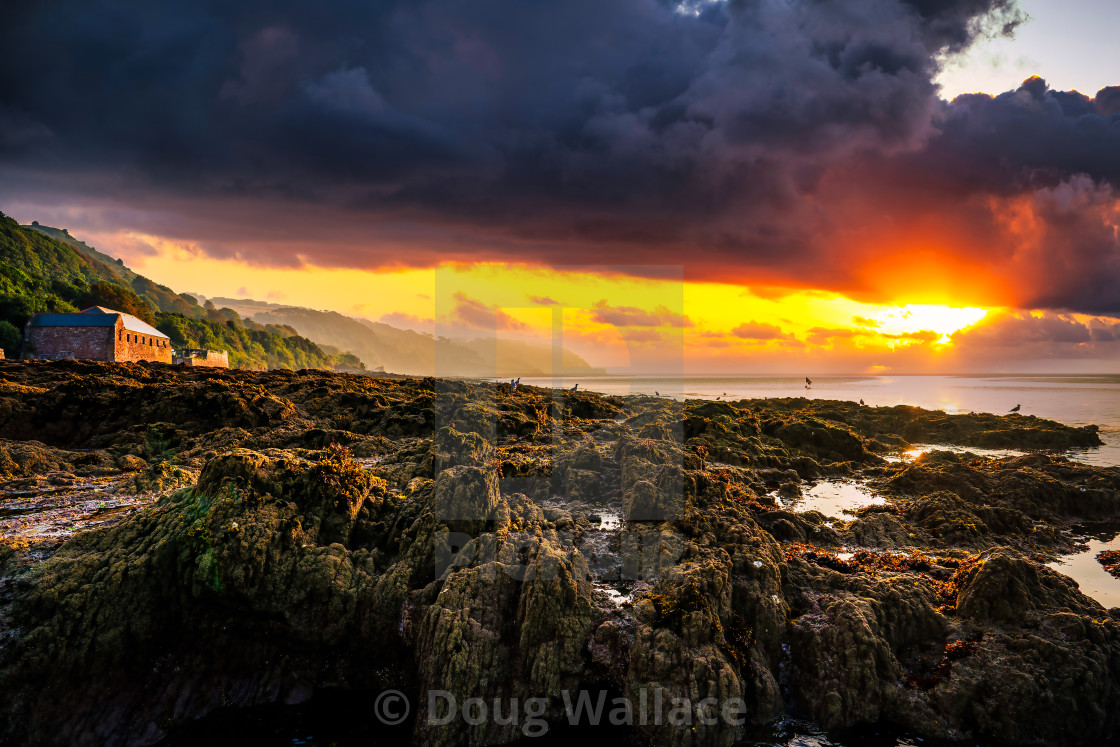 "Sunrise from Kingsand beach, Cornwall, UK." stock image