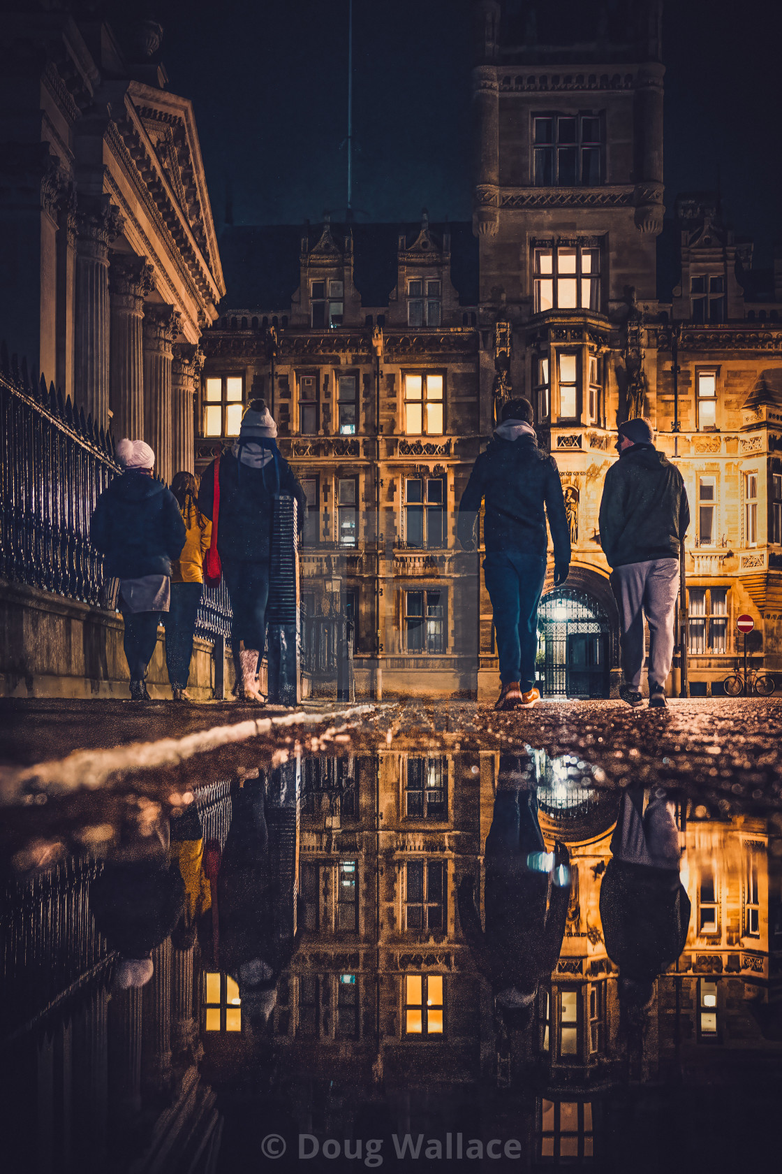 "Night reflections of Gonville & Caius College, University of Cambridge." stock image