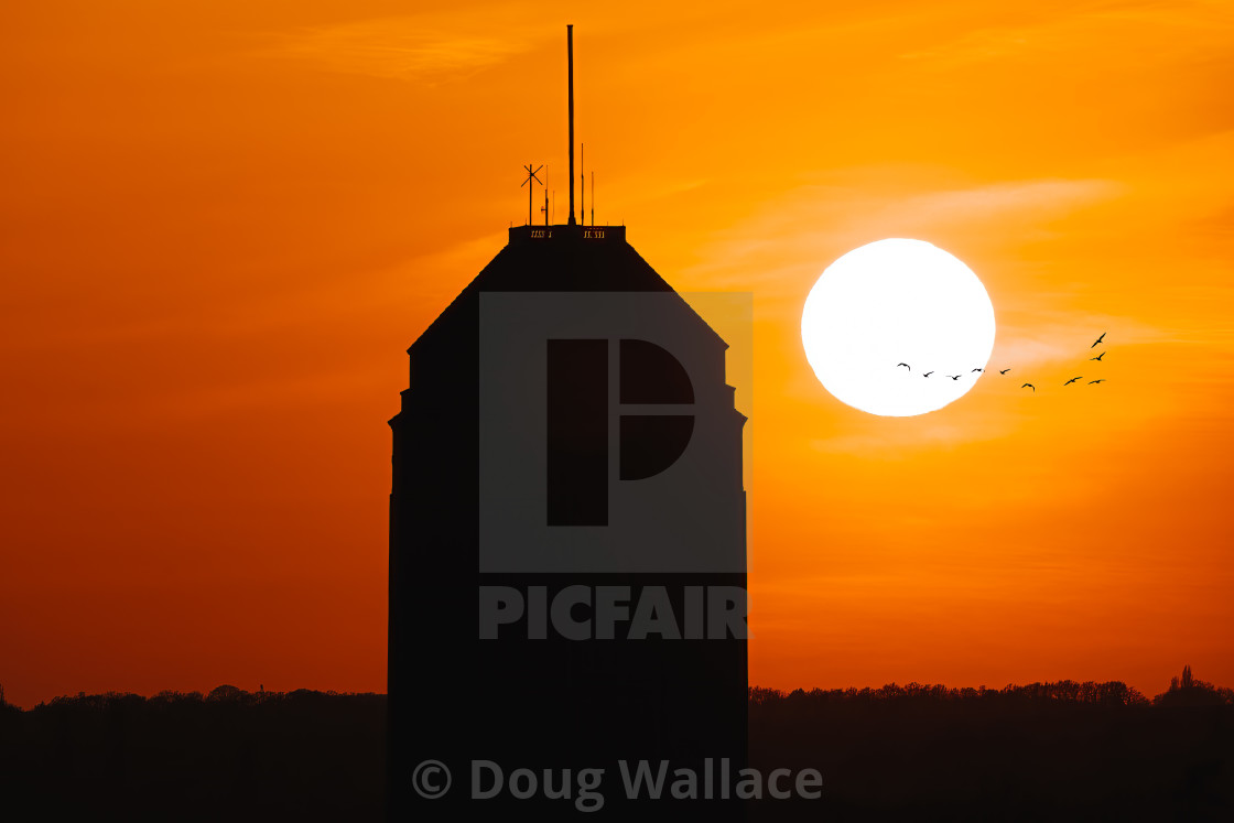"Golden hour sunset and silhouette of Cambridge University Library." by Doug Wallace - $24.31 "Golden hour sunset and silhouette of Cambridge University Library." stock image