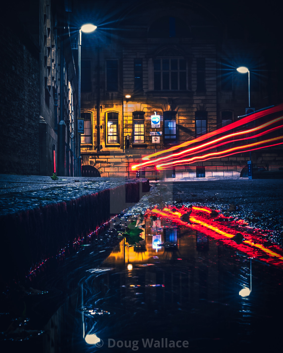 "Light trail reflections from Tennis Court Road, Cambridge UK." stock image