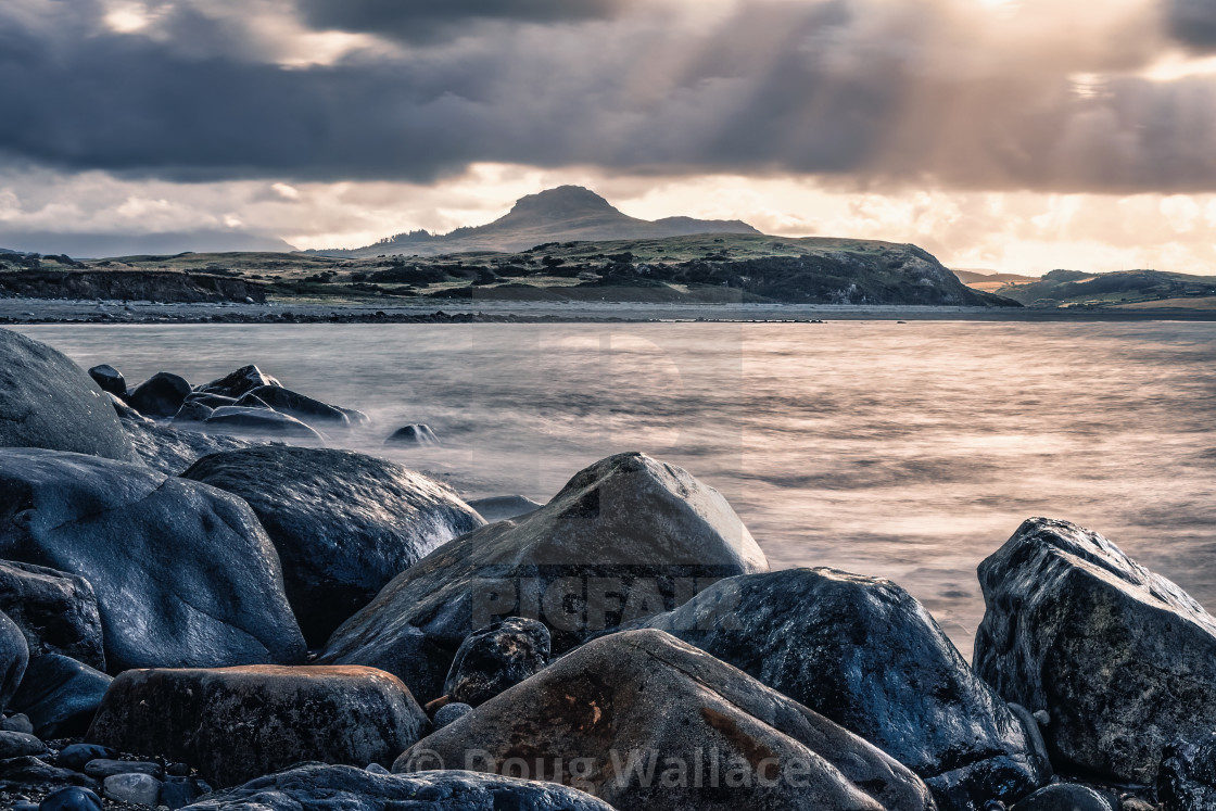 "Sunrise, Criccieth Beach, Gwynedd, Wales UK." stock image