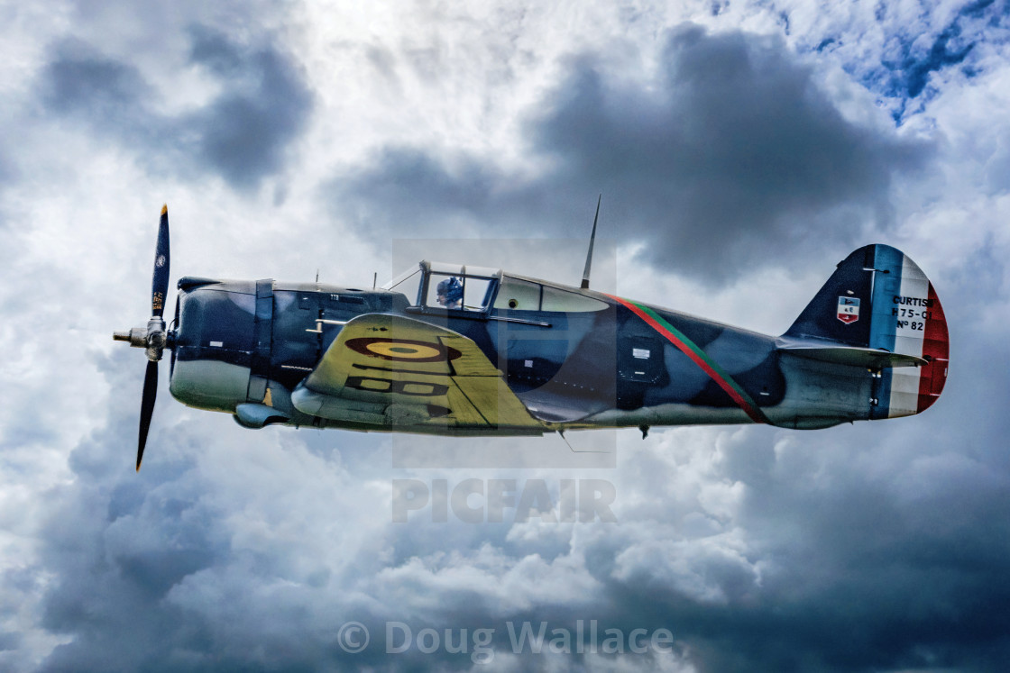 "Curtiss Hawk H 75A1 FAF GC2 5 X881 flying over Duxford, UK." stock image