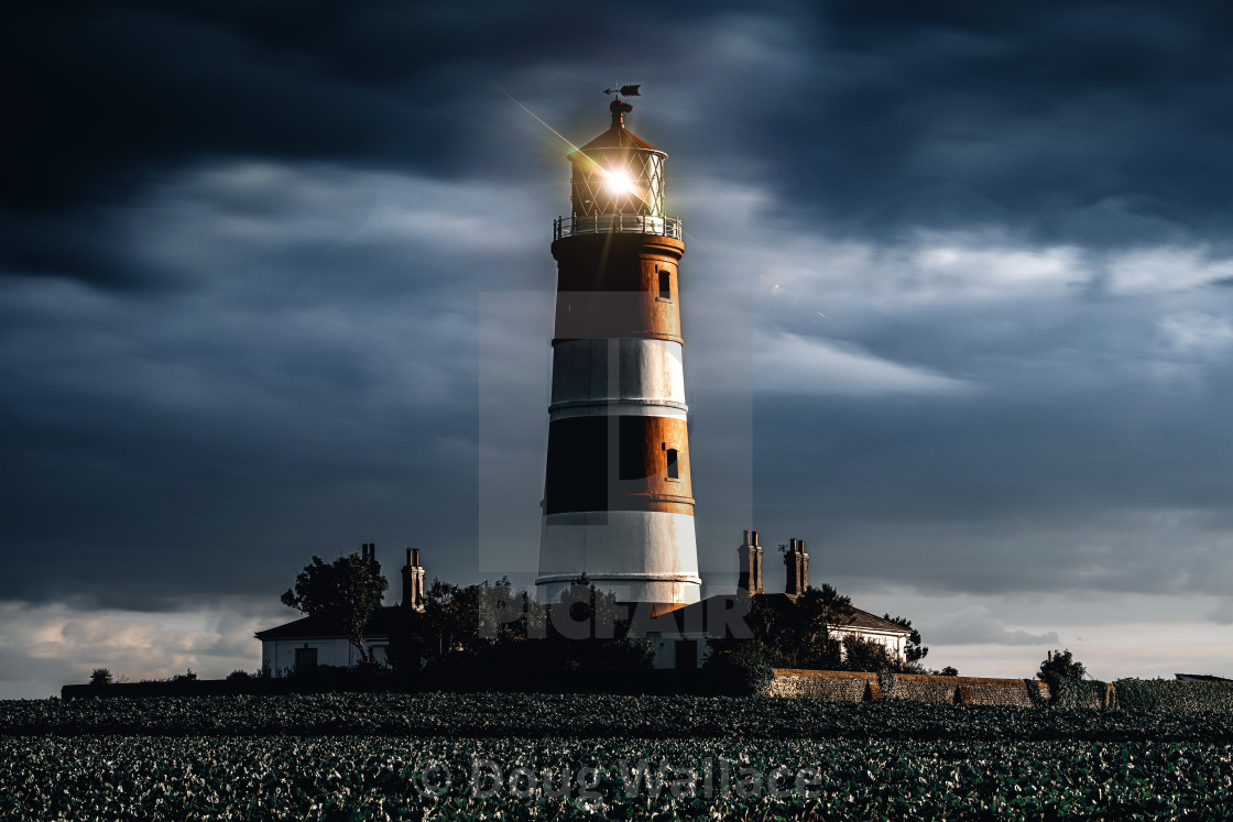 "Happisburgh Lighthouse at dusk, Norfolk UK." stock image