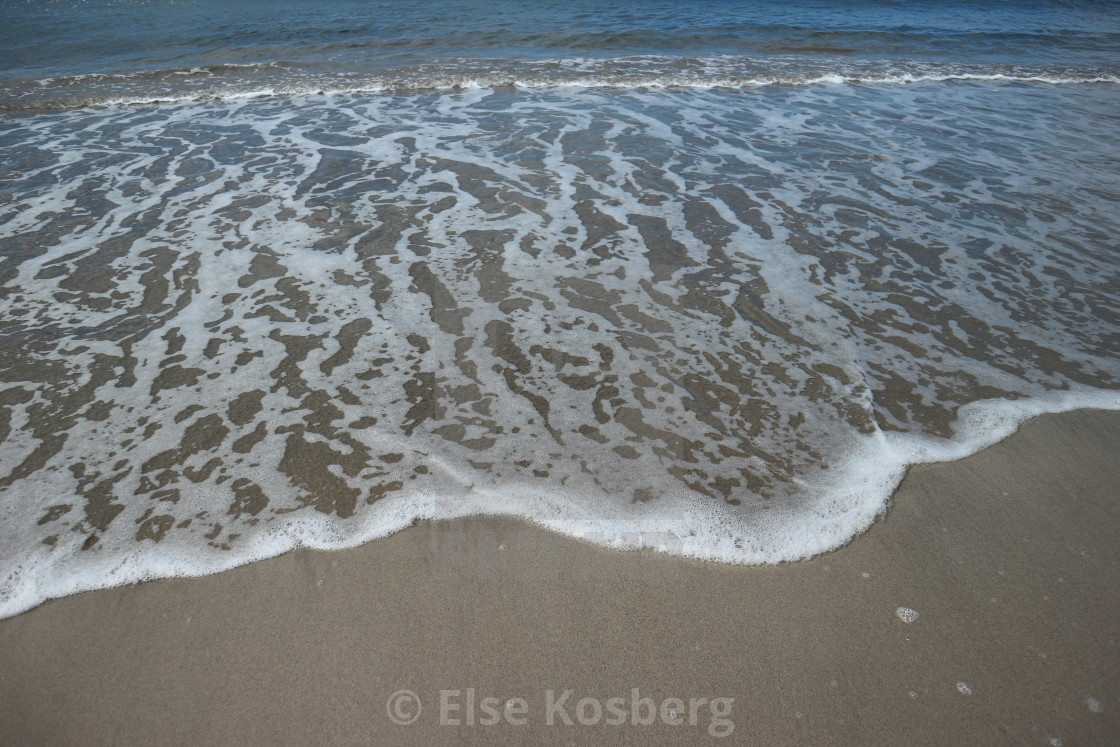 "Sea rushing to the shore" stock image