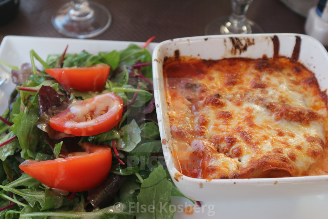 "Lasagne with green salad" stock image