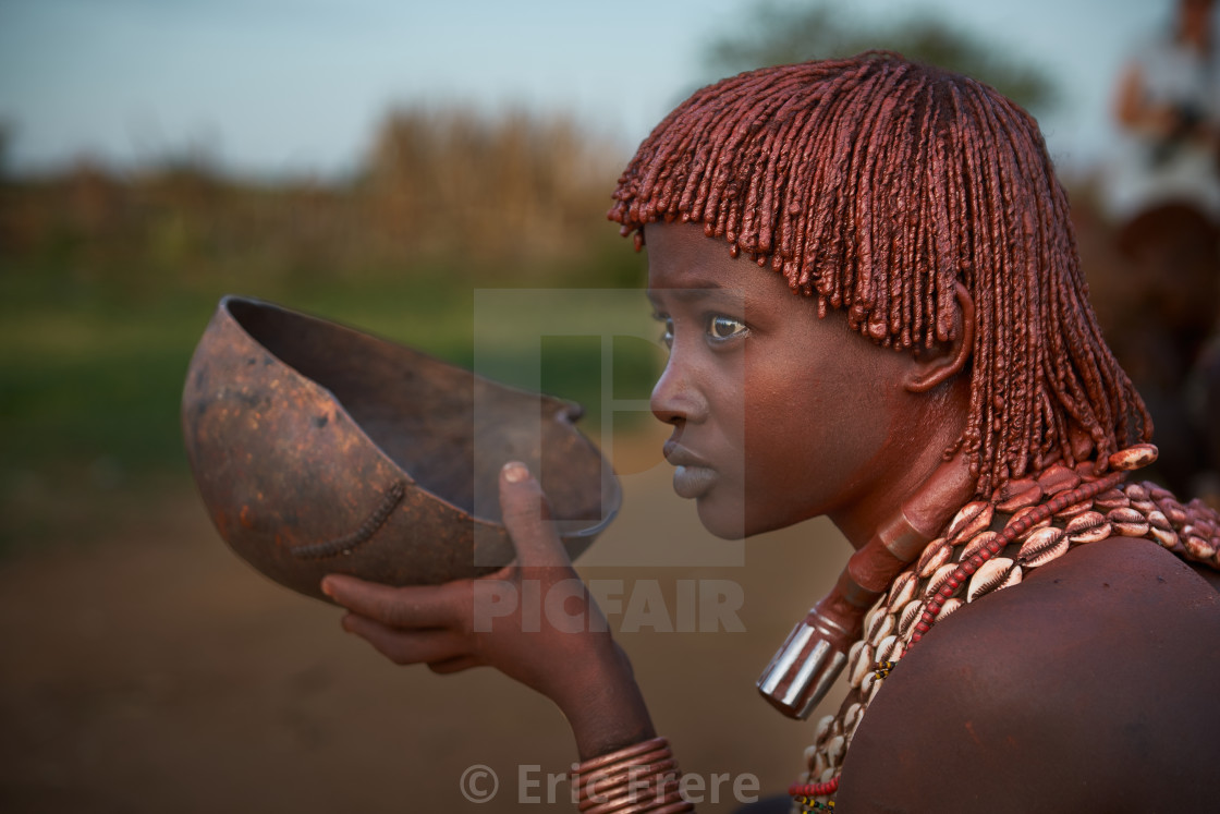 "Hamer tribeswoman having her early morning breakfast" by Eric Frere - $40.35 "Hamer tribeswoman having her early morning breakfast" stock image