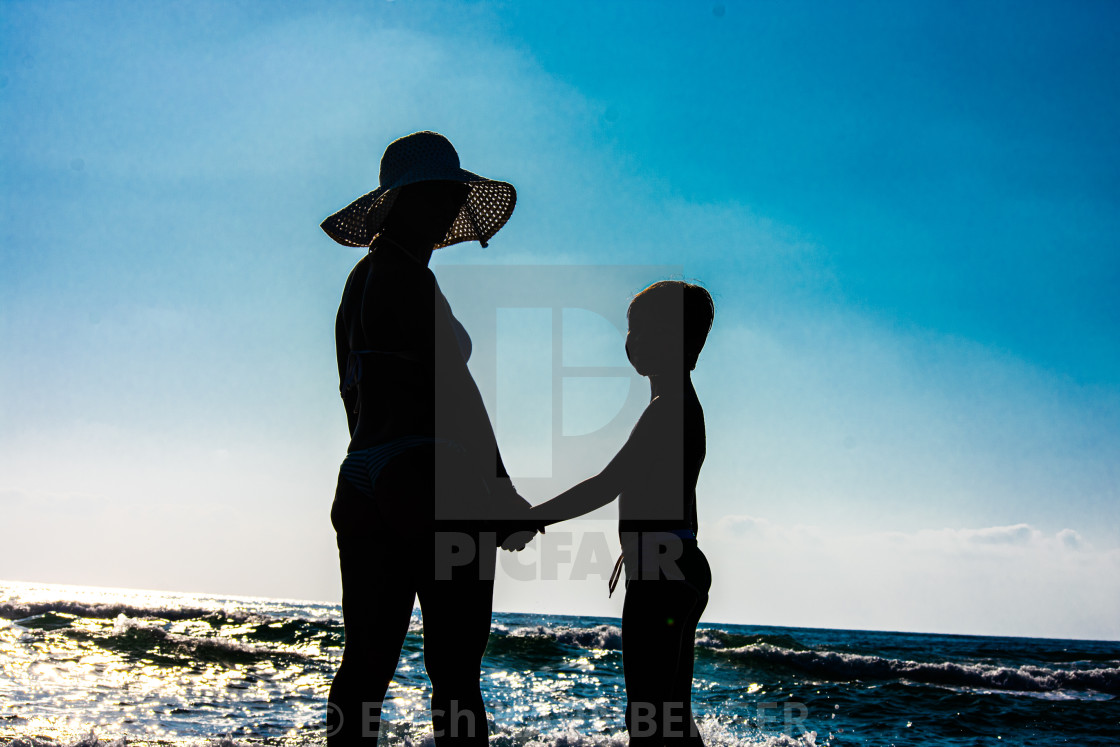 Women And Boy Holding Hands On The Beach License Download Or Print For 10 00 Photos Picfair