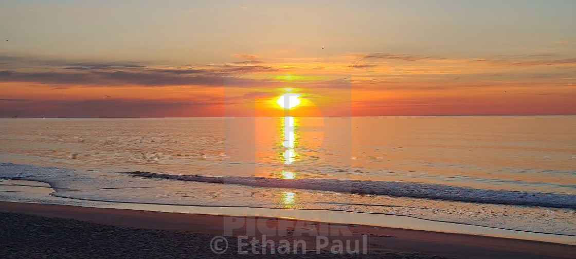 "Hazy Orange Sunrise" stock image