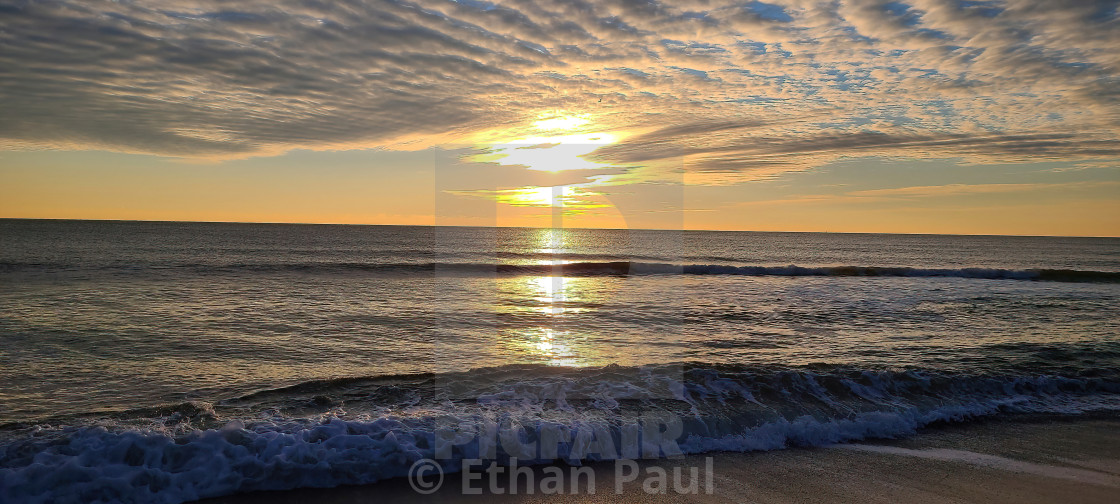 "FEATHERED CLOUDS AT SUNRISE" stock image